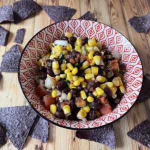 Bowl filled with corn and black bean salsa