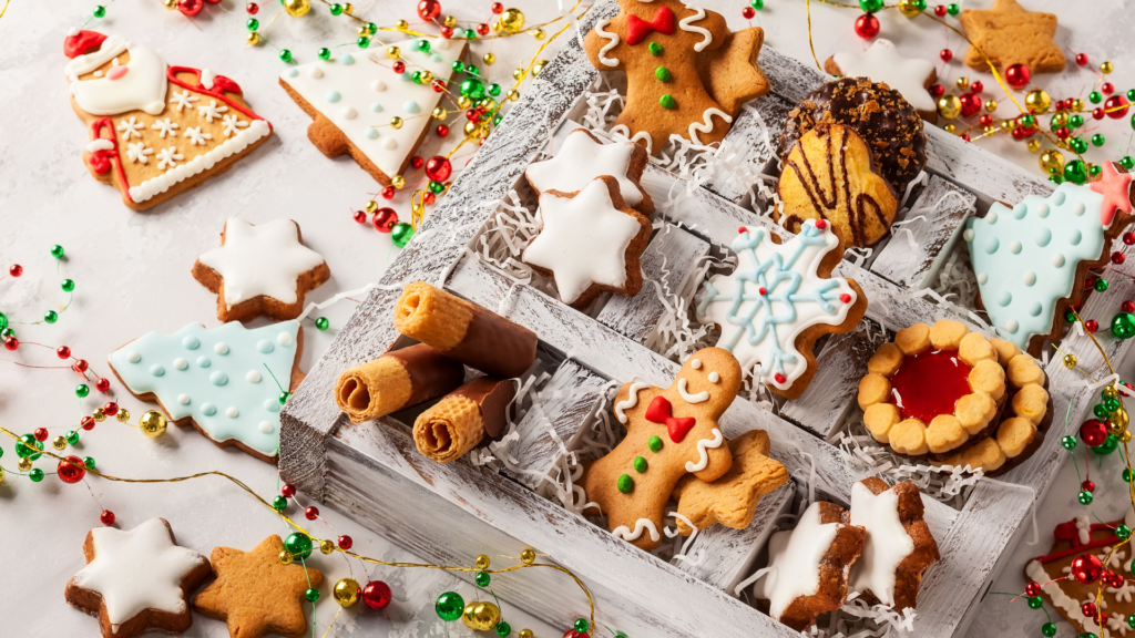 10 Healthy Eating Tips For the Holidays- table covered with variety of different Christmas cookies